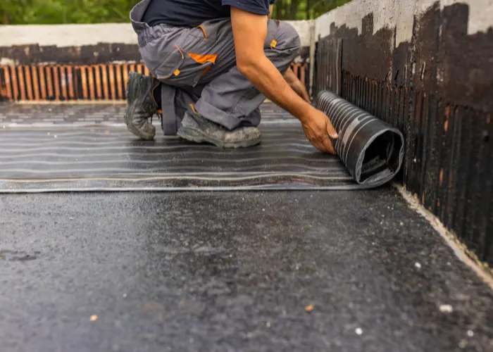 A flat roof being repaired and waterproofed