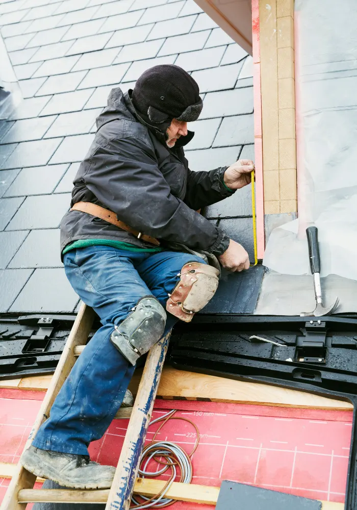 A Wesley Chapel Roofing contractor repairing a roof