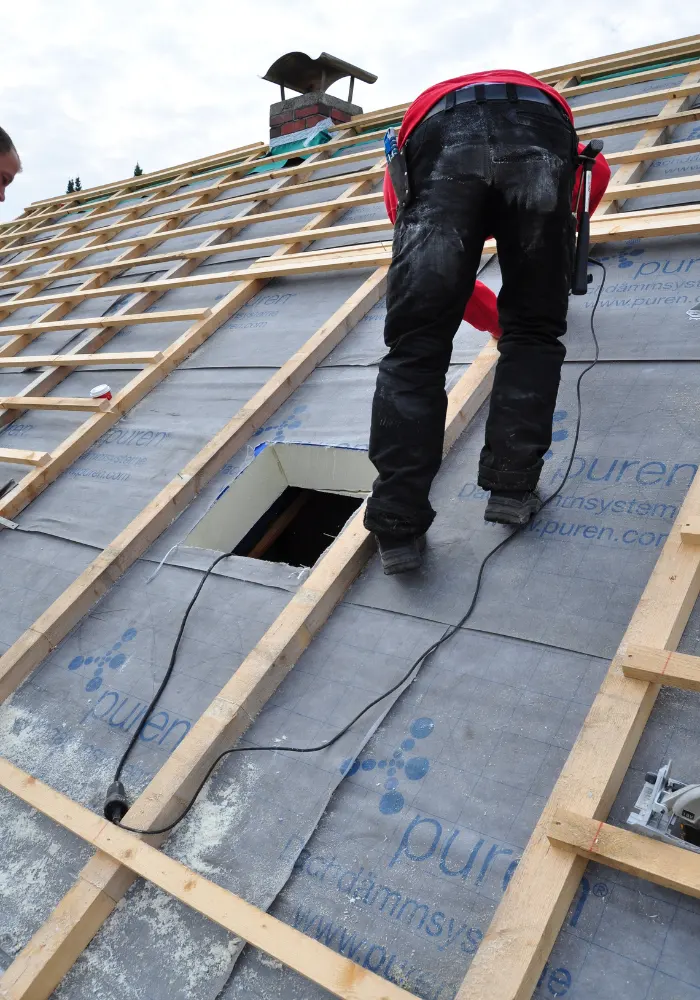 A Wesley Chapel Roofing worker replacing a roof